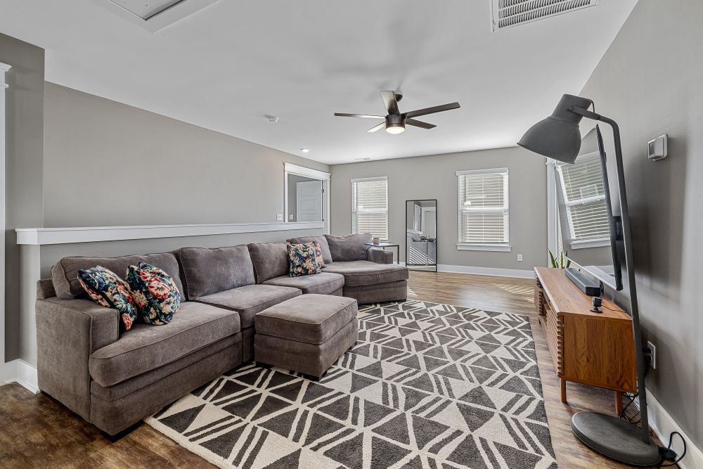 A clean, modest and inviting living room in a finished home